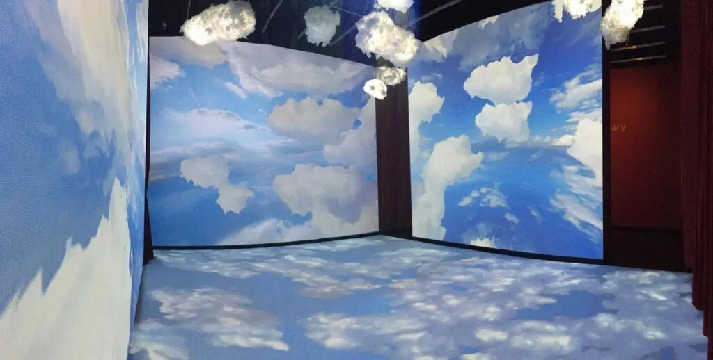 Interior of the Cloud Room at The Salvador Dalí Museum — immersive cloud projection on walls, ceiling, and floor — by Pixel Rain Digital